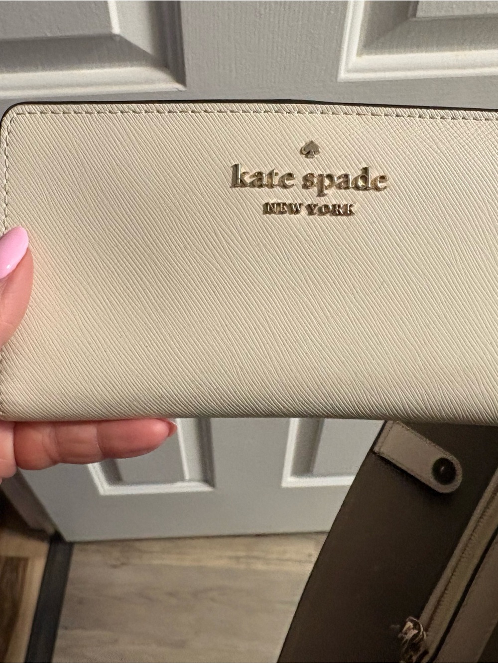 kate spade Cream Saffiano Zip Wallet with Gold Logo